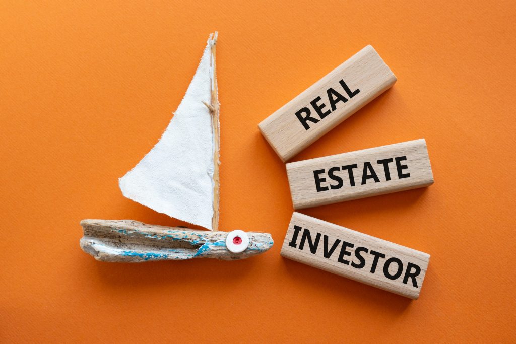 Drift wood sail boat symbolizing launching real estate investing career