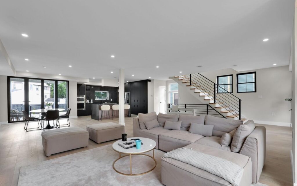 Picture of the modern sitting room with the view of stairs in the background