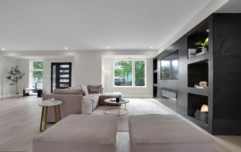 The photo of the modern front door complimenting other black accents