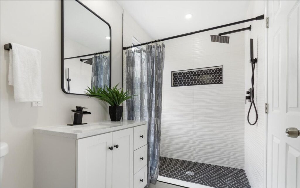 A picture of a white bathroom after the renovation