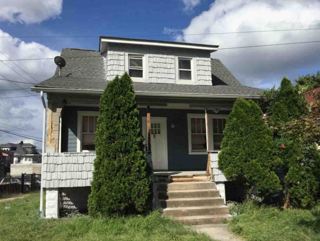 The picture of the exterior of a Baltimore City house before the renovation.