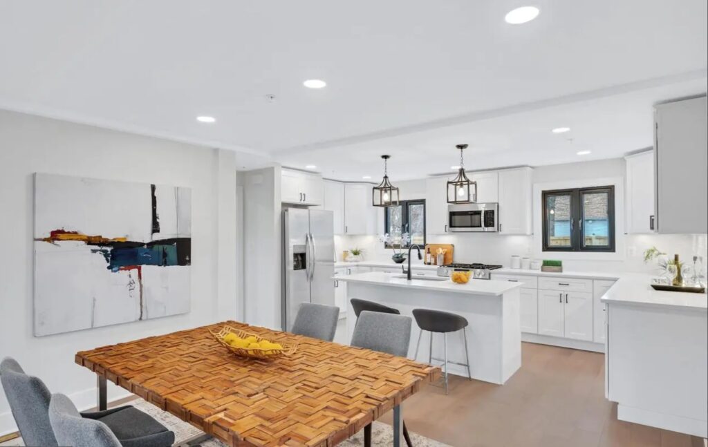 A newly renovated interior with a kitchen in the background