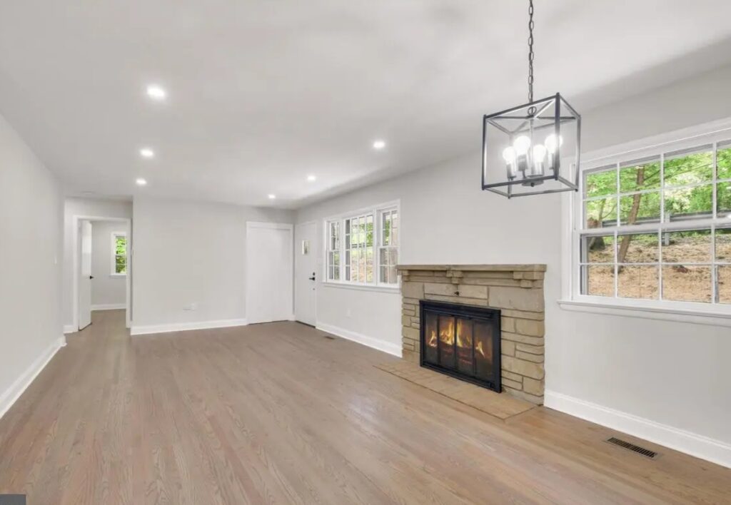 Unstaged after-renovation photo of the living room with a fireplace