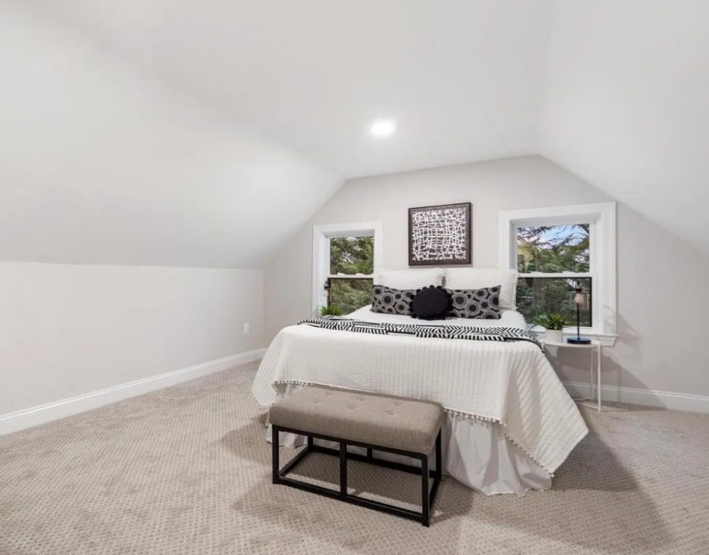 Beautiful white bedroom in the attic
