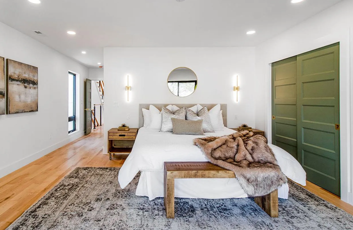 Luxurious bedroom with a fur throw.